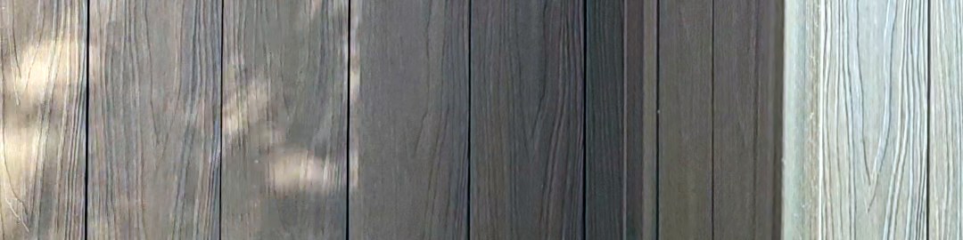 Morning sun across wood-grain siding, close up