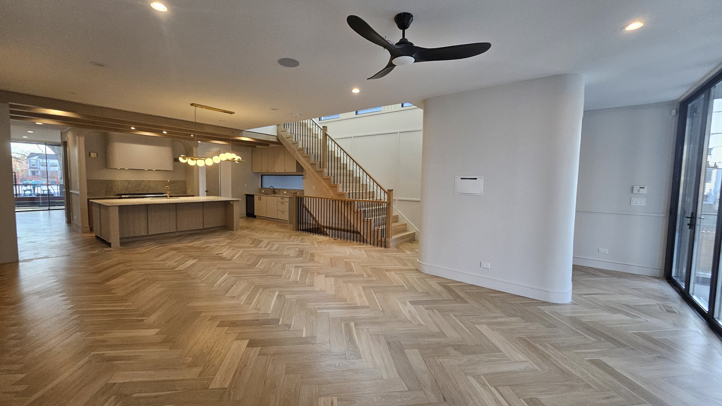 White oak herringbone through an open living floor
