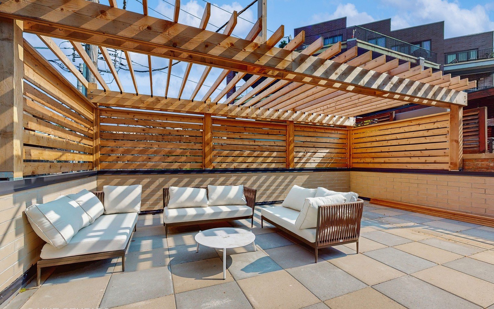 Cedar pergola and screens over pavers