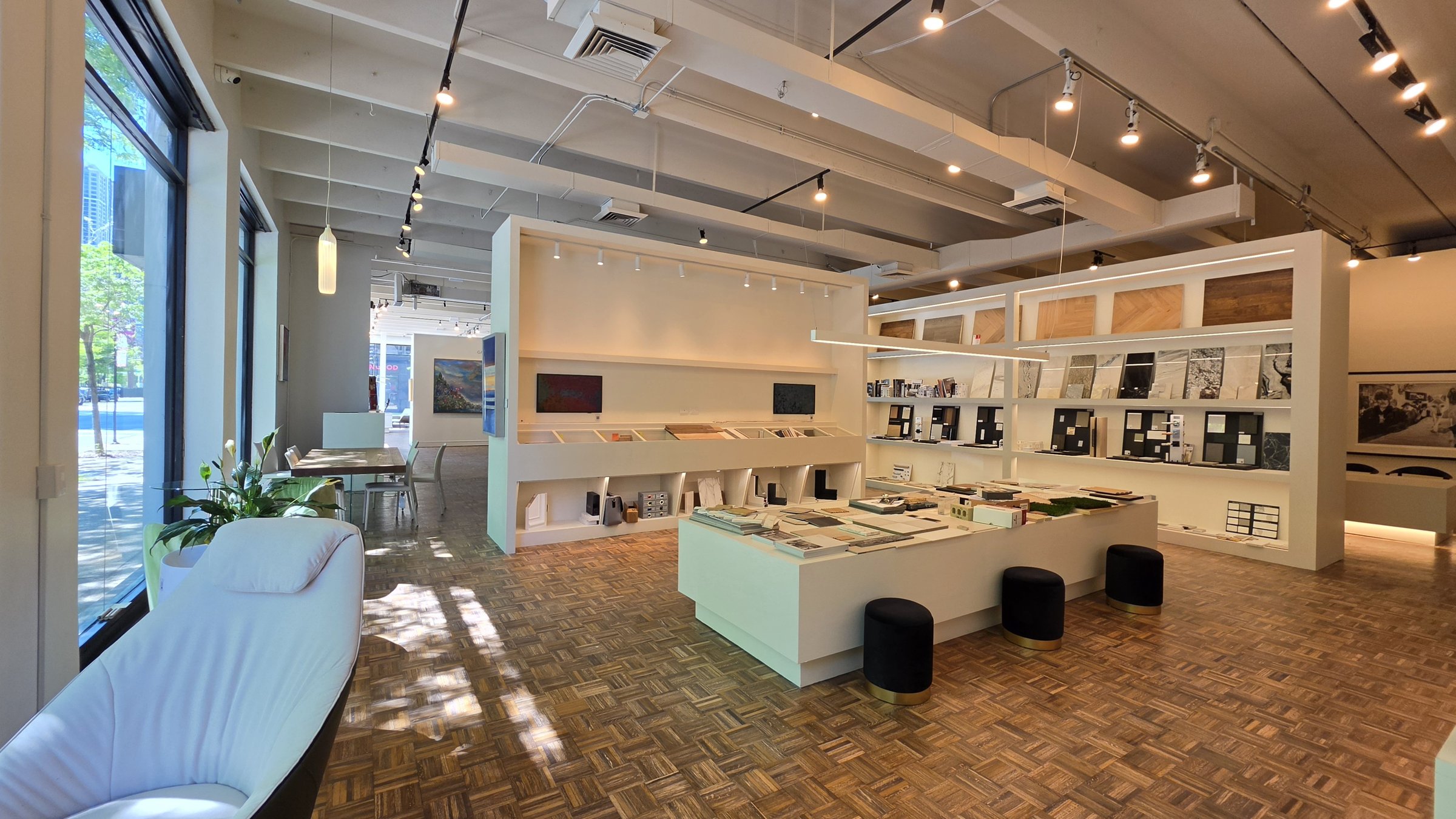Lit sample shelves, wood and stone panels, sample table